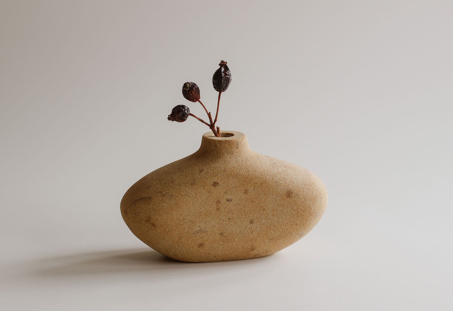 Stem vase carved in Dunhouse buff stone.jpg
