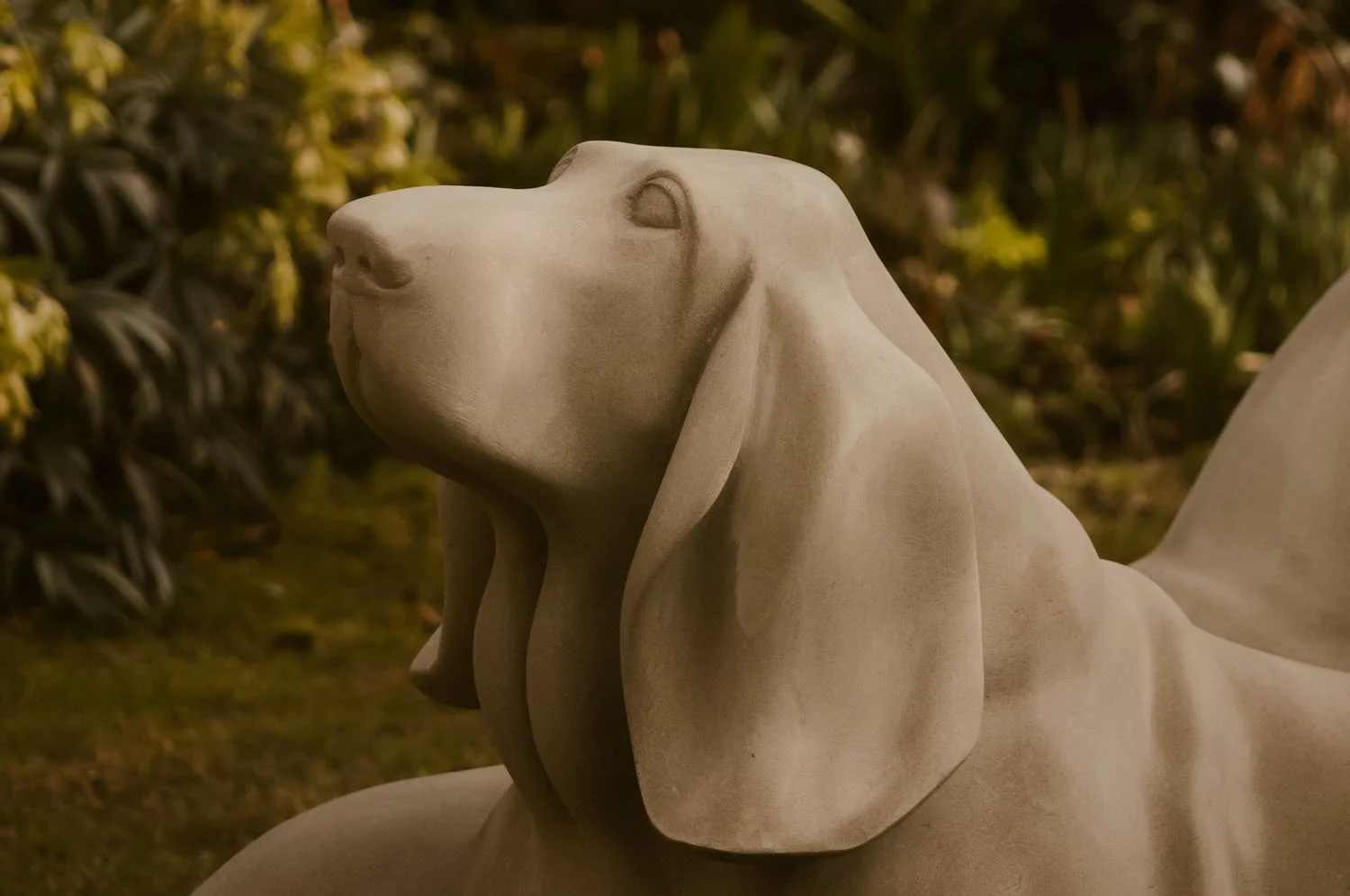 Detail of Basset Hounds sculpture carved in Yorkstone