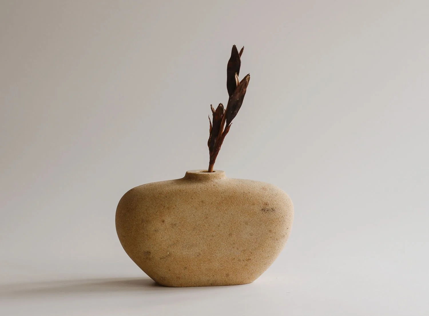 Stem vase in buff sandstone.jpg