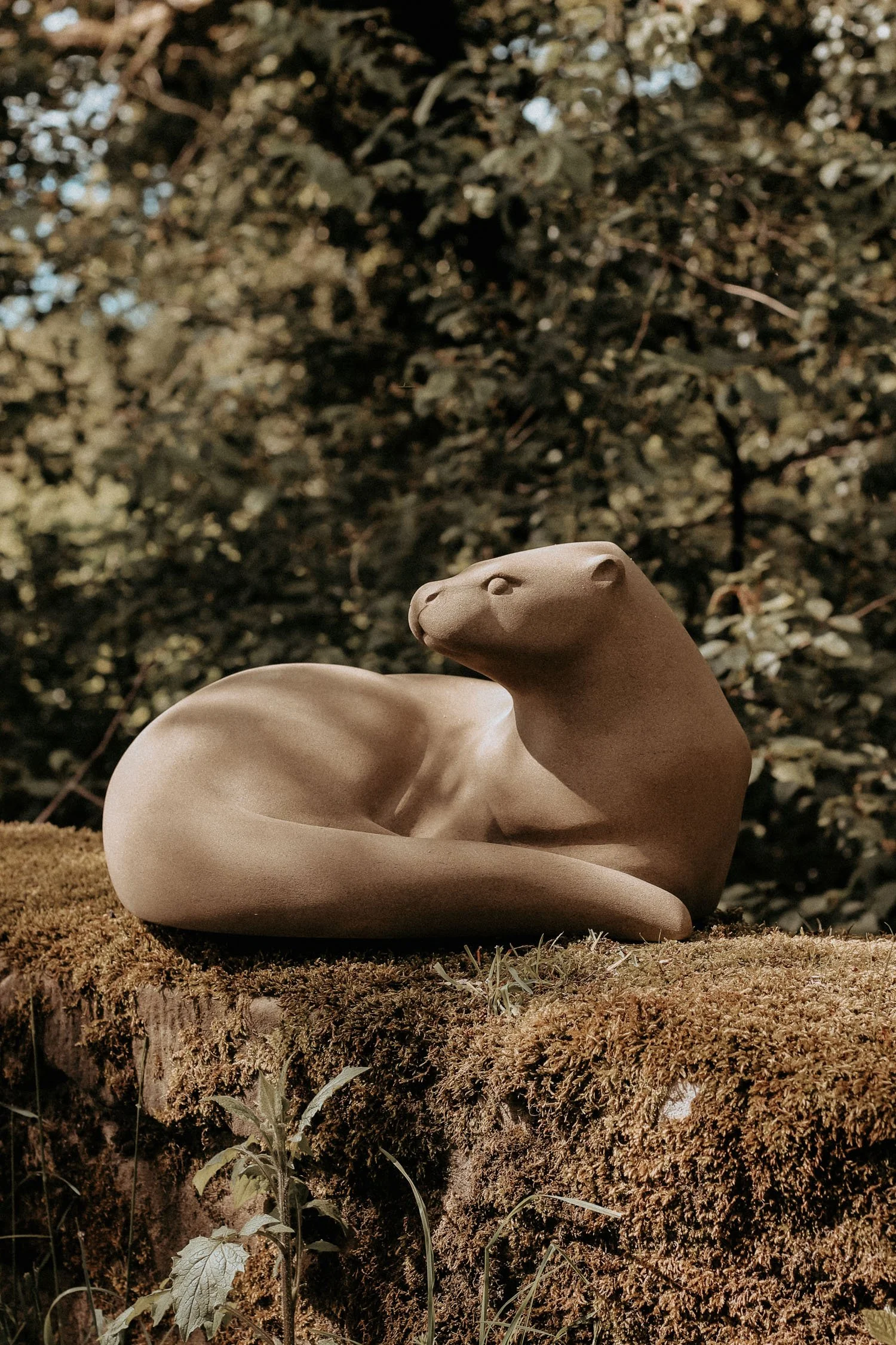 Sculpture of an Otter curled up resting commissioned by Hillsborough Castle and Gardens