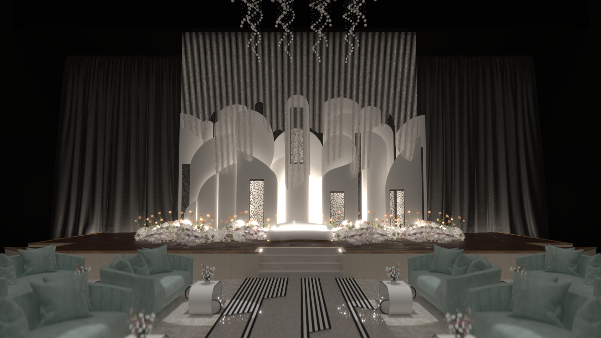 Elegant stage with modern design, white floral arrangements, decorative panels, and soft seating area with sofas and pillows for an event or wedding celebration.