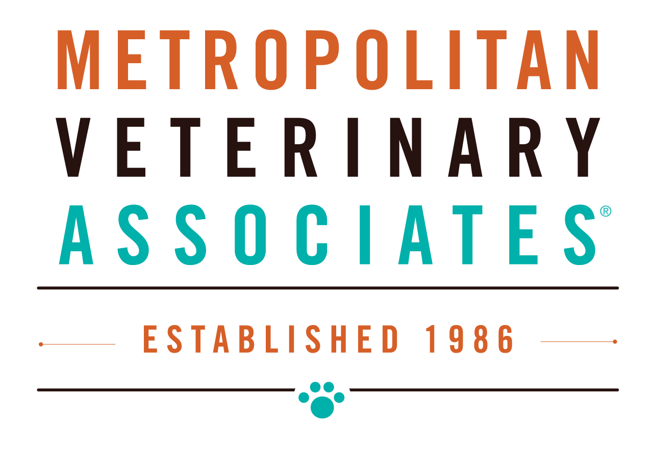 Logo for Metropolitan Veterinary Associates established in 1986, featuring the name in bold uppercase letters with different colors and a paw print icon.