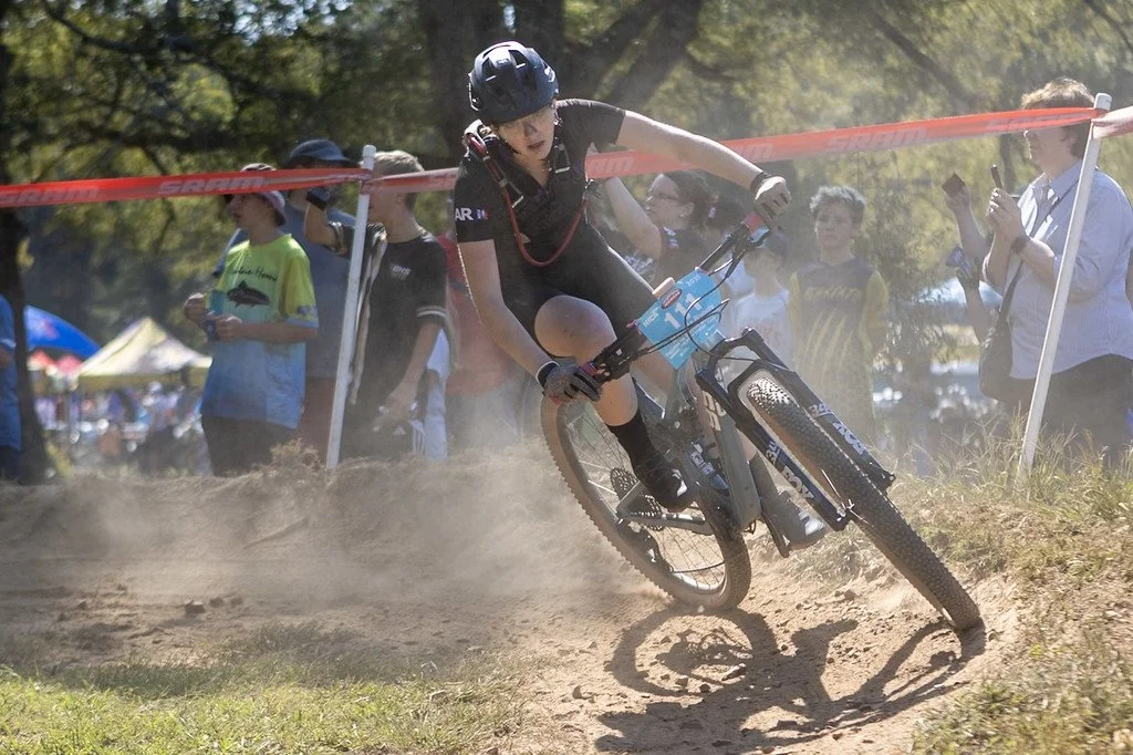  FayMTB rider and GRiT member Makaela Rogers during the Arkansas NICA Conway Mid-Season Classic in Conway.  (Photo by Clay Gambill.)  
