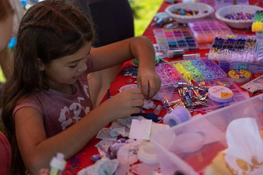  The GRiT tent offers a way for girls to support each other and show their creativity.  (Photo by Clay Gambill.)  
