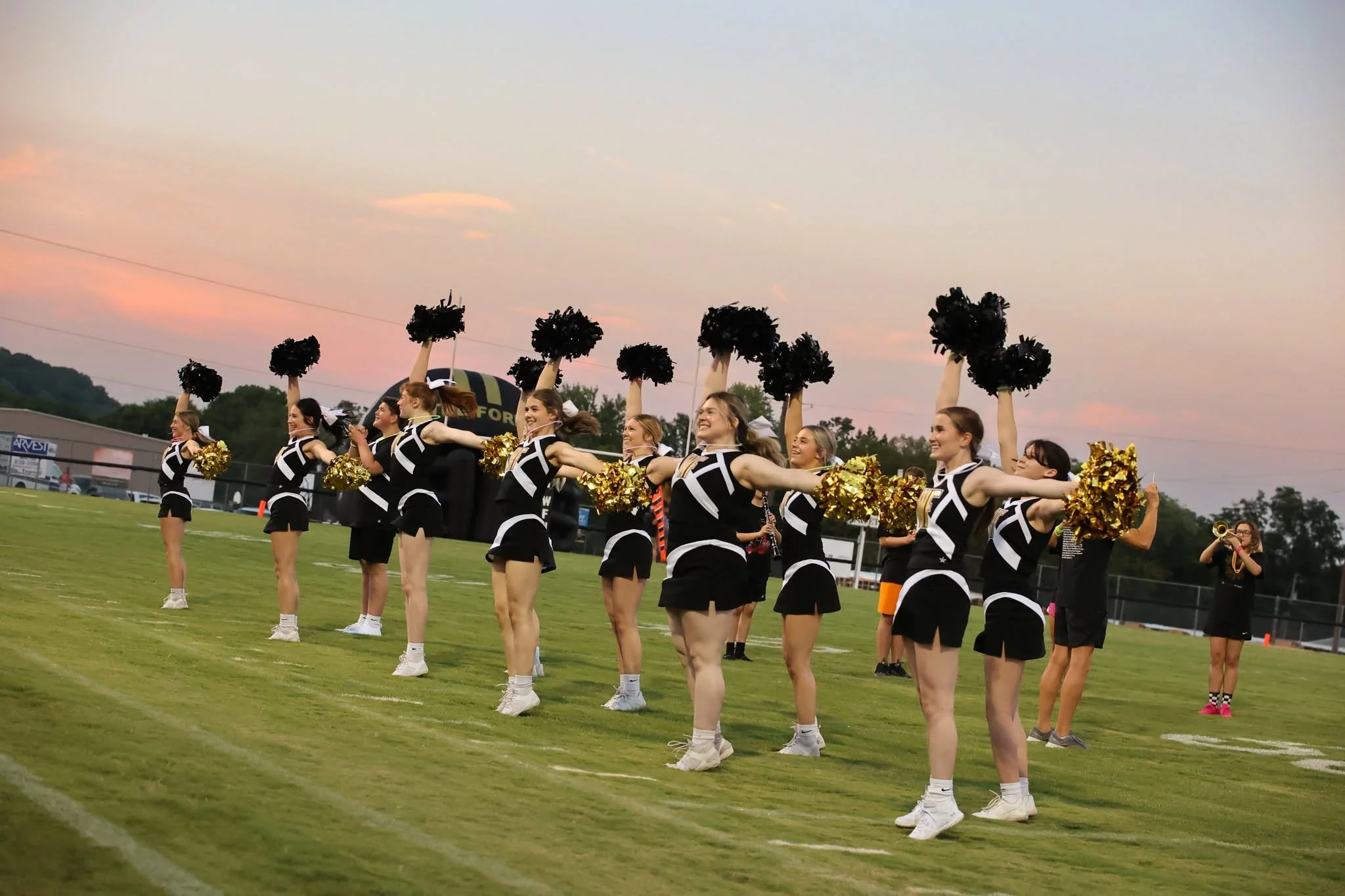  The West Fork High School cheerleaders draw fans to Friday night games. ( Photo by Nhi Blansett ). 