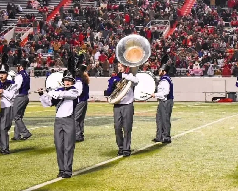  Marching bands, like the Elkins High School band pictured here, help make Friday nights memorable.  (Photo by Keith Cazer).  