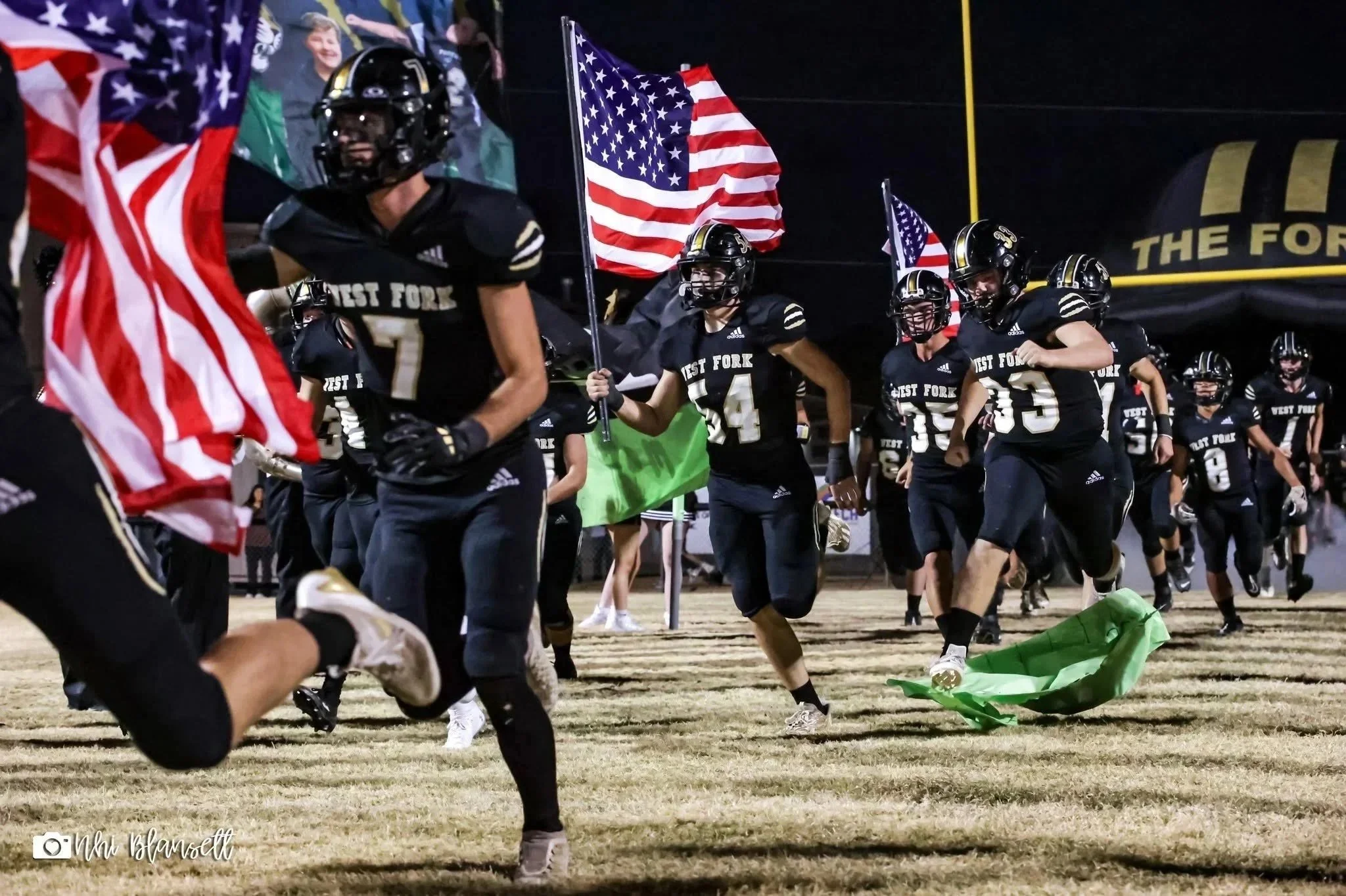  The West Fork High School football team draws fans to Friday night games. ( Photo by Nhi Blansett ). 