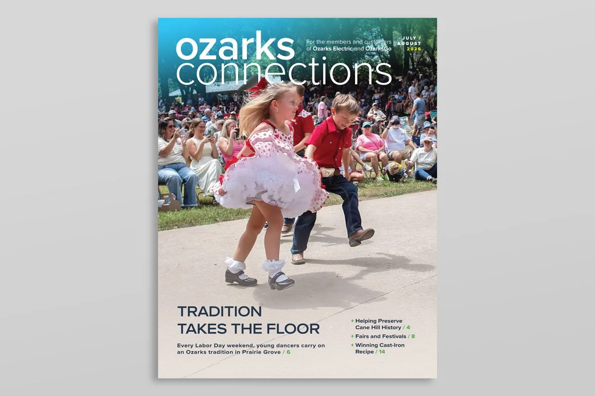 Cover of Ozarks Connections magazine, January/February 2026, with a scenic view of a green valley and hills, featuring power lines, and article titles about Ozark power history and local stories.