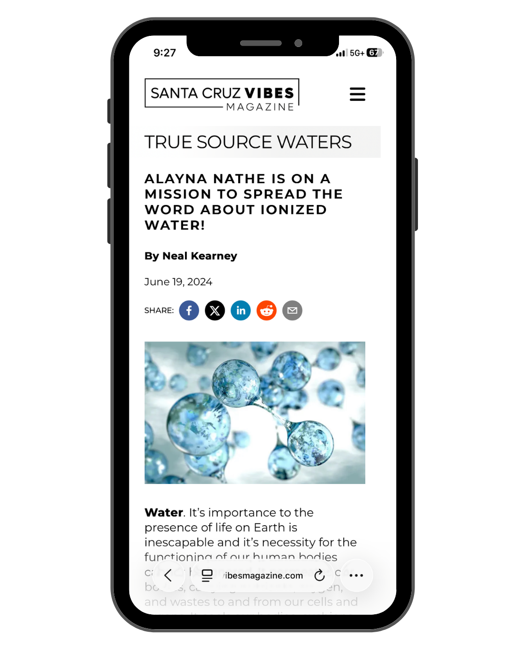 Mobile phone displaying an article from Santa Cruz Vibes Magazine titled 'True Source Waters,' featuring a photo of water molecules and discussing the importance of water.