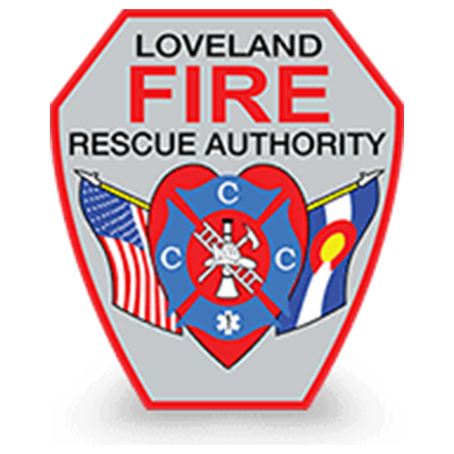 Badge of Loveland Fire Rescue Authority featuring a heart with firefighter tools, flags, and the words 'Loveland Fire Rescue Authority' and 'Fire' in bold red letters.