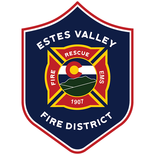 Logo of Estes Valley Fire District, featuring a shield shape with a central Maltese cross, a mountain landscape, and the Colorado state flag. Text includes 'Estes Valley Fire District,' 'Rescue,' 'Fire,' 'EMS,' and the year 1907.