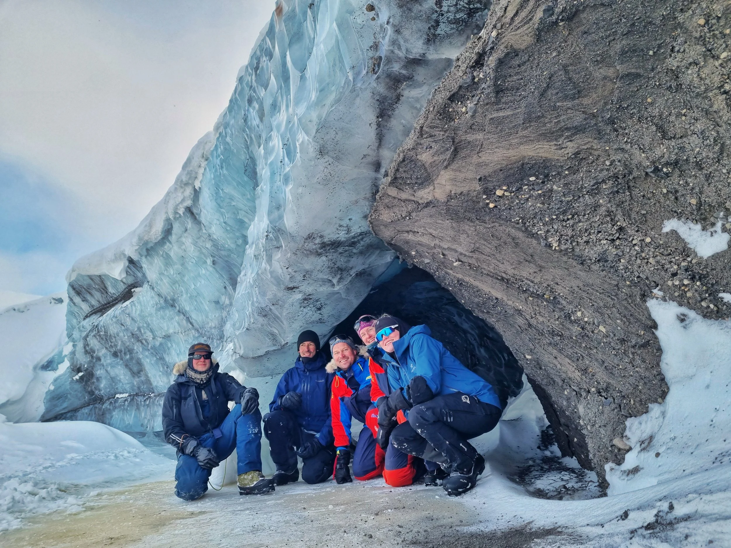 Posing for a photo next to a smal meltwater channel