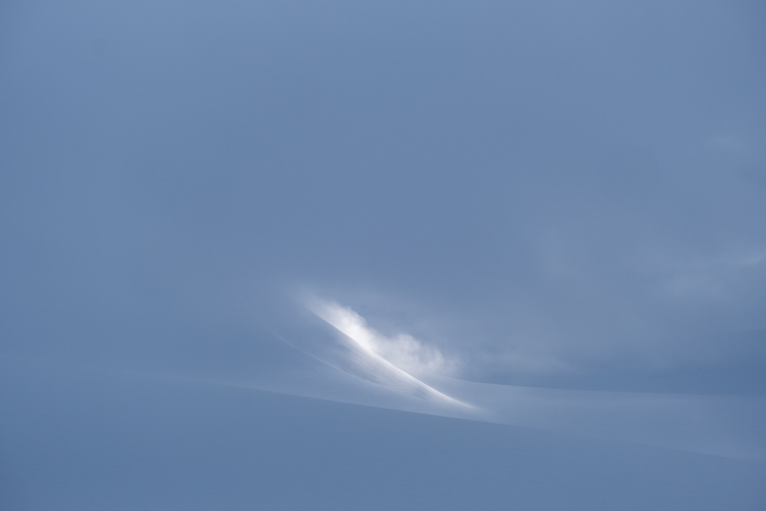 The sun shining through the clouds