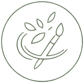 Paintbrush with leaves and paint splashes inside a circle, symbolizing art and nature.