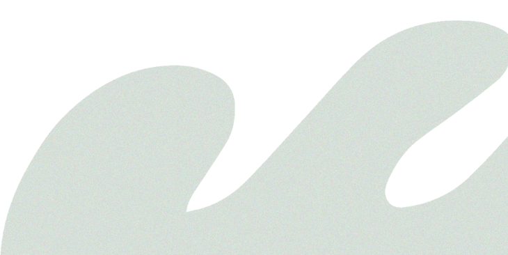 Close-up of an abstract or stylized letter 'W' in light color against a black background.