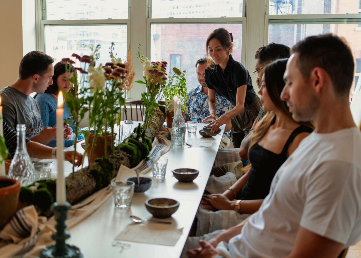 Guests at the supper club event being served with a curated menu with nutritional thinking by health coach, Nutritional Therapy Practitioner Maggie Ng