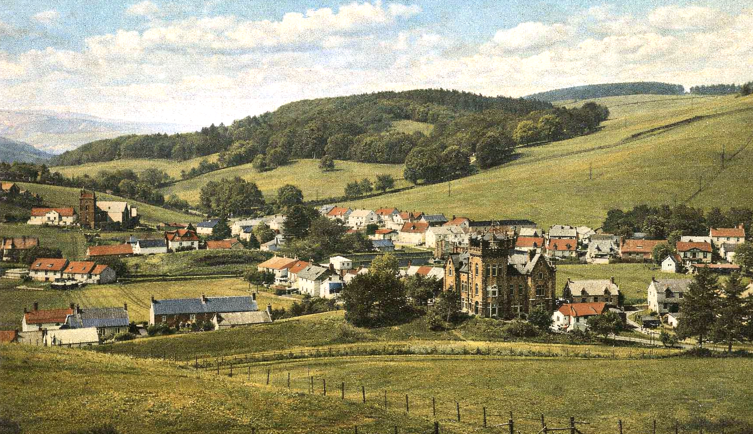 A scenic painting of a small village in a valley surrounded by green rolling hills under a partly cloudy sky.