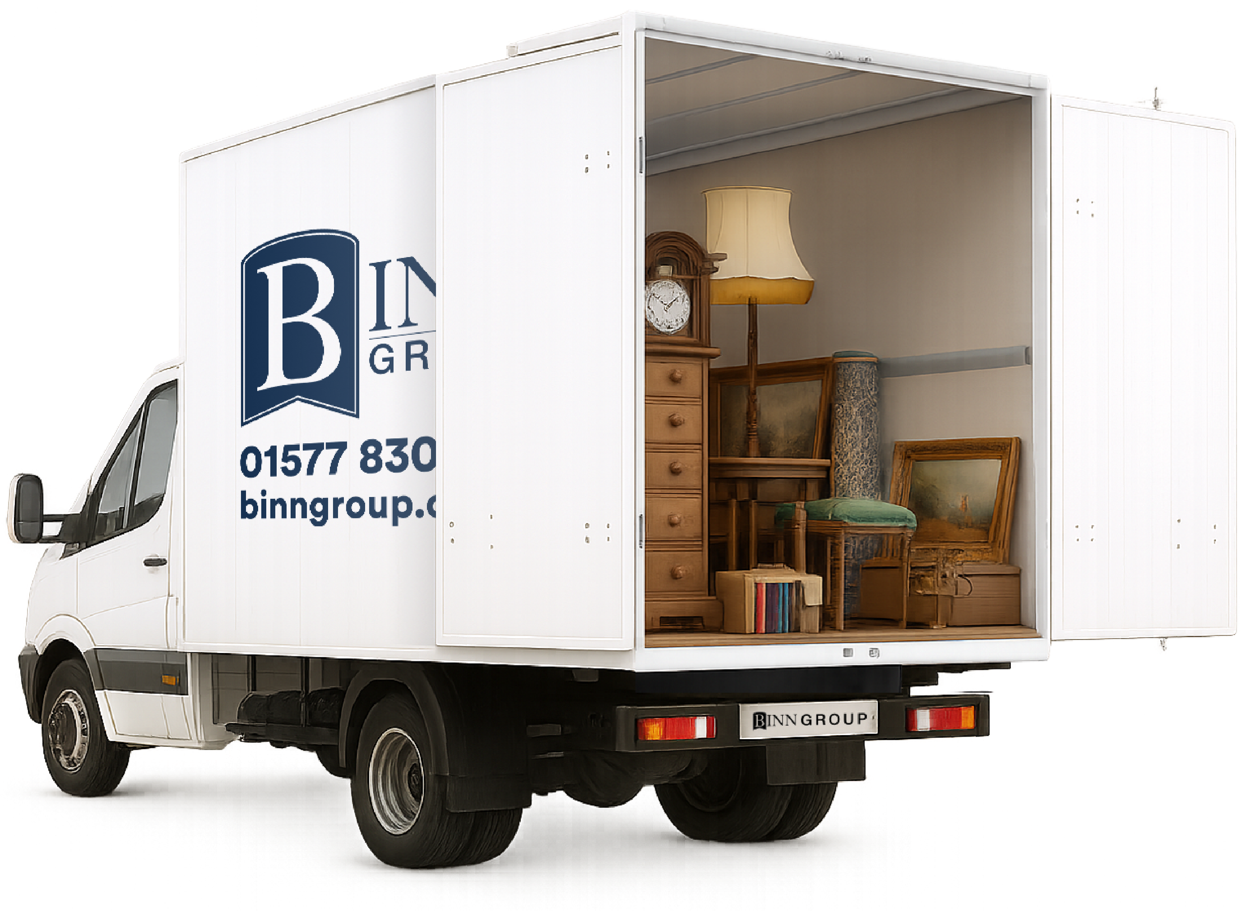 A moving truck with the back door open, revealing furniture and household items inside.