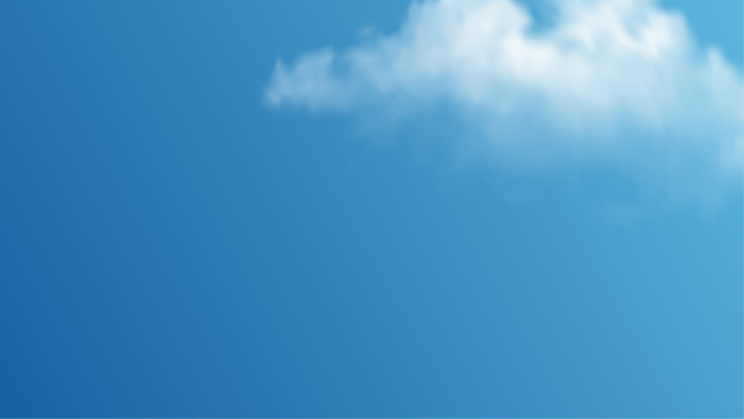 Partially cloudy blue sky with some white clouds visible.
