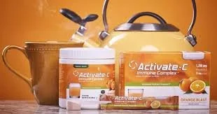 Boxes and bottles of Activate-C supplement, kettle, and mug