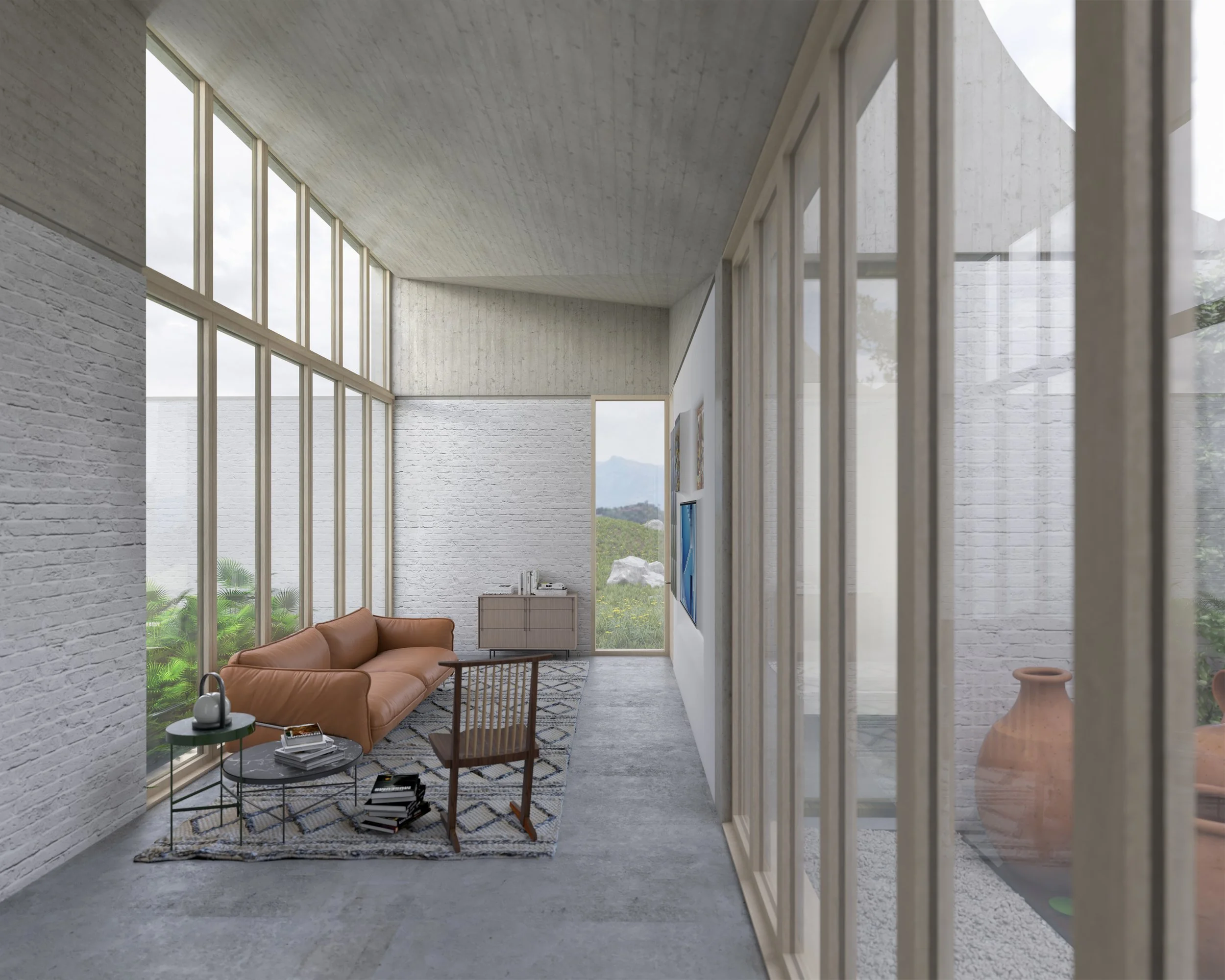 The family room of the Courtyard House has large windows, white brick walls, a tan leather sofa, a wooden chair, a patterned rug, and views of two of courtyards.