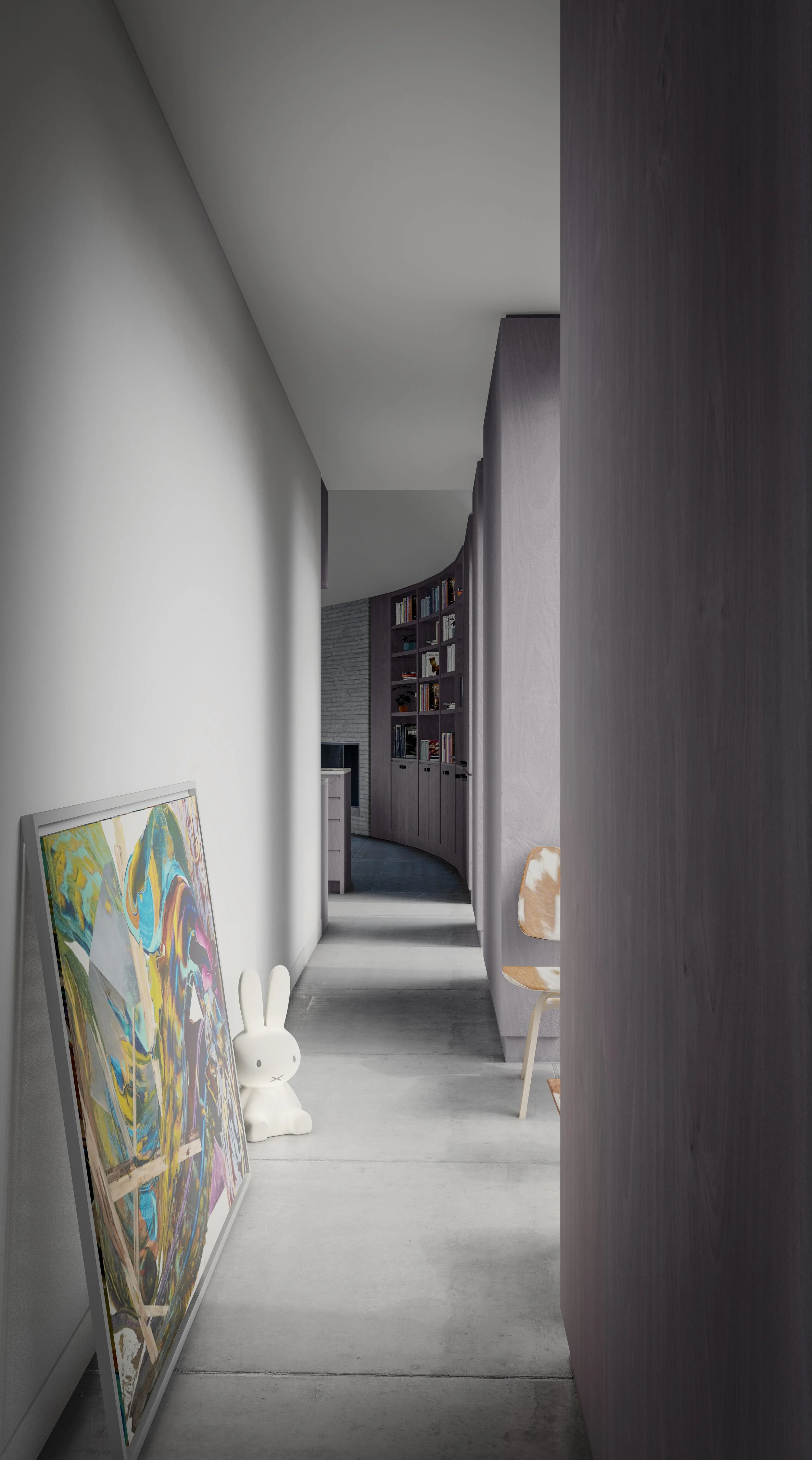 Each wing of the Y House is different. This one has light-colored walls and concrete floor, and is decorated with a colorful abstract painting leaning against the wall, a white bunny lamp, and a wooden chair.