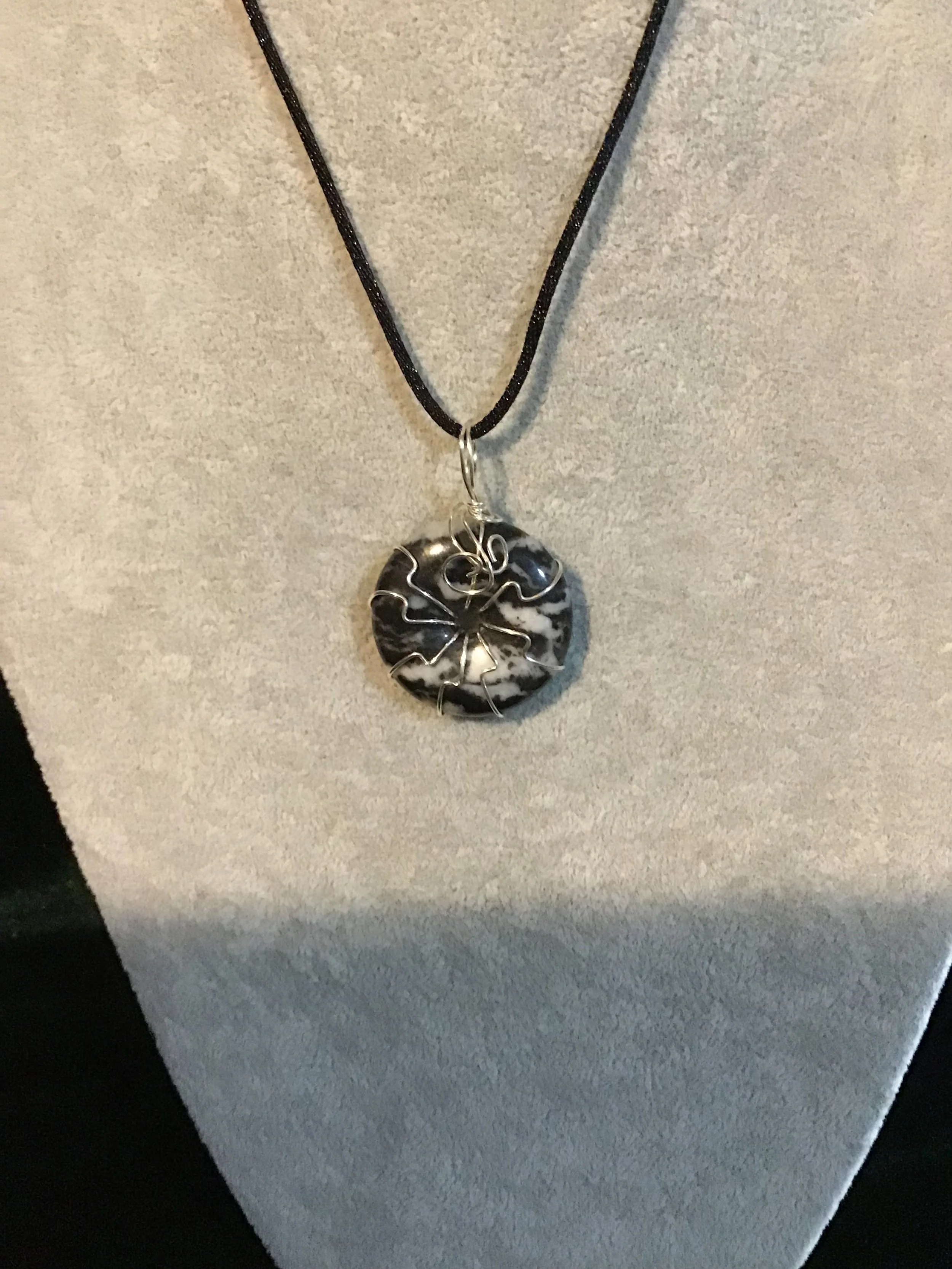 Wire wrapped Black and White Striped Onyx gemstone donut on18 black satin adjustable cord