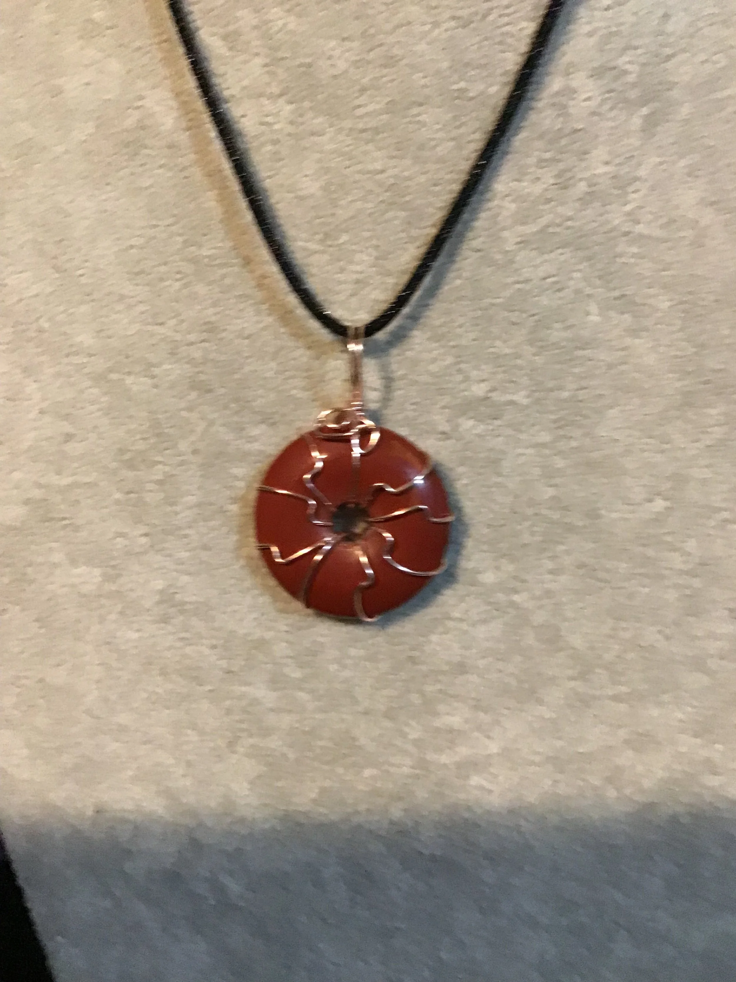 Wire wrapped Red Mookaite gemstone donut on18 black satin adjustable cord