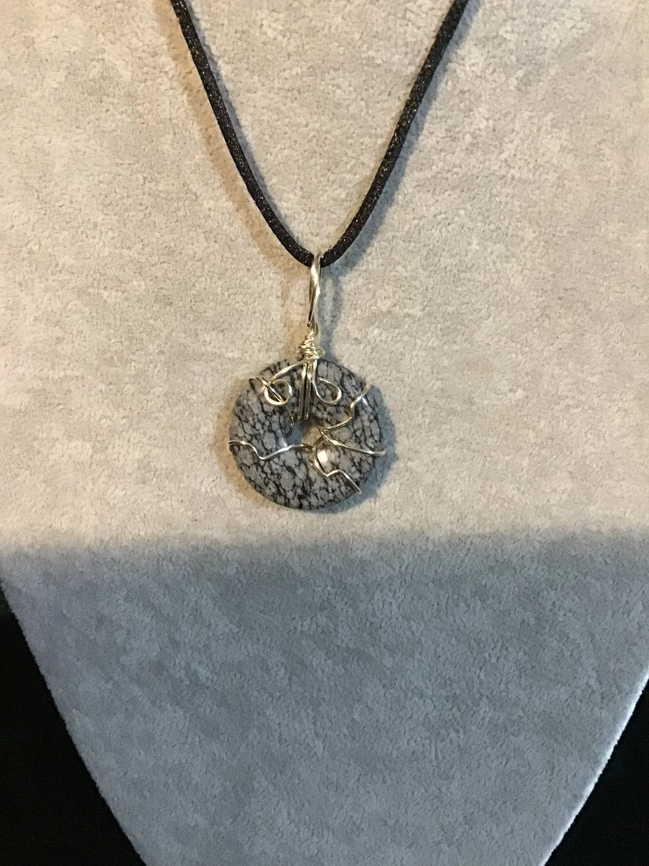 Wire wrapped Snowflake Obsidian gemstone donut on18 black satin adjustable cord