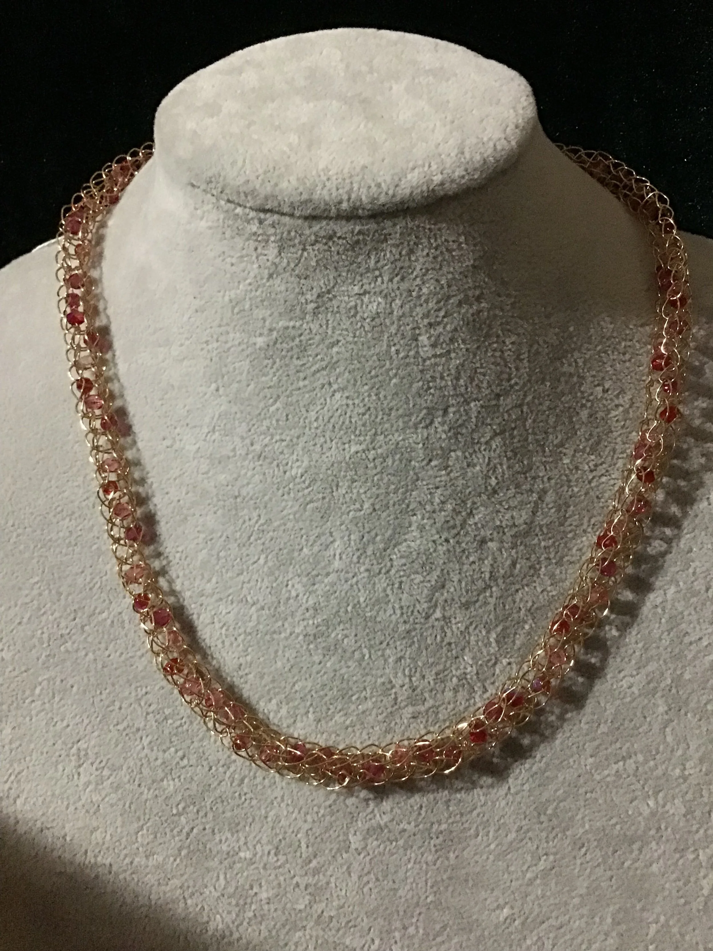 Handwoven chain with crystals.