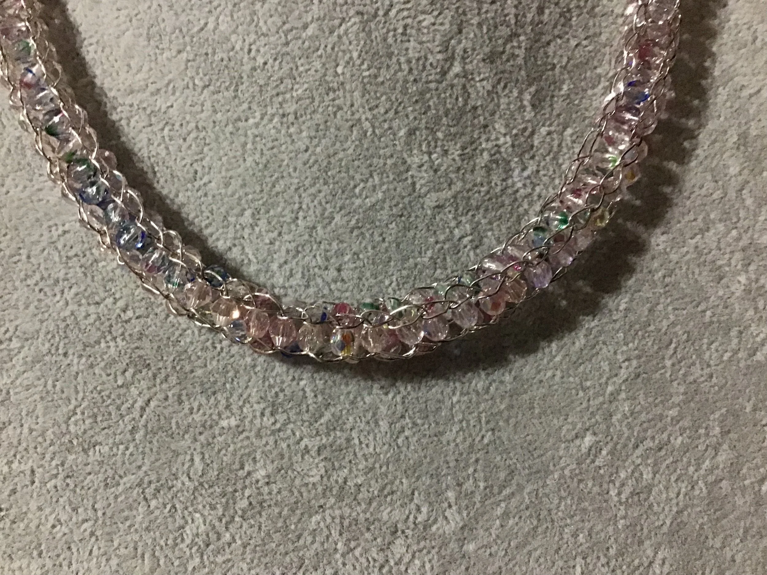 Handwoven chain with crystals.