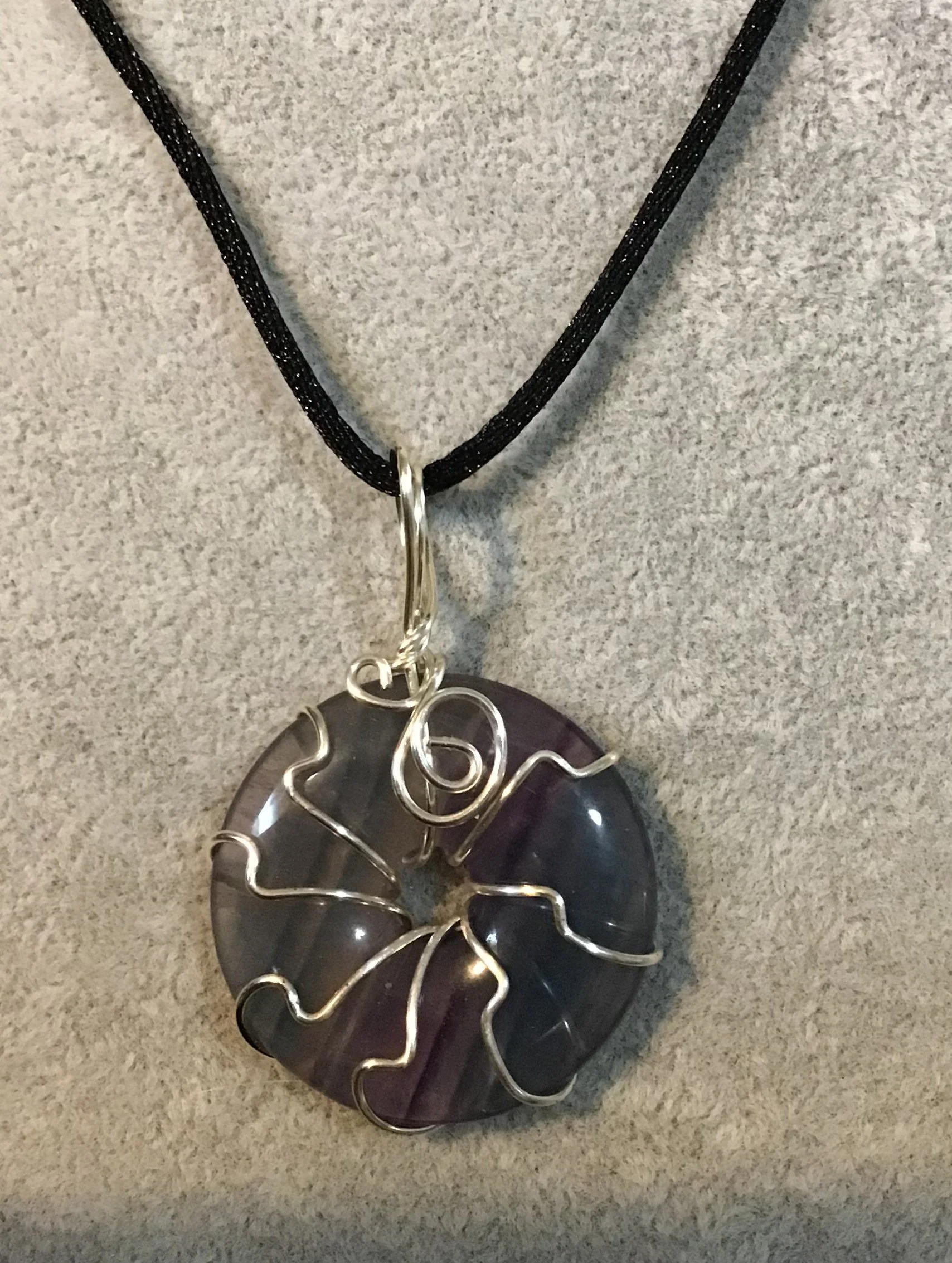 Wire wrapped Rainbow Fluorite gemstone donut on18 black satin adjustable cord