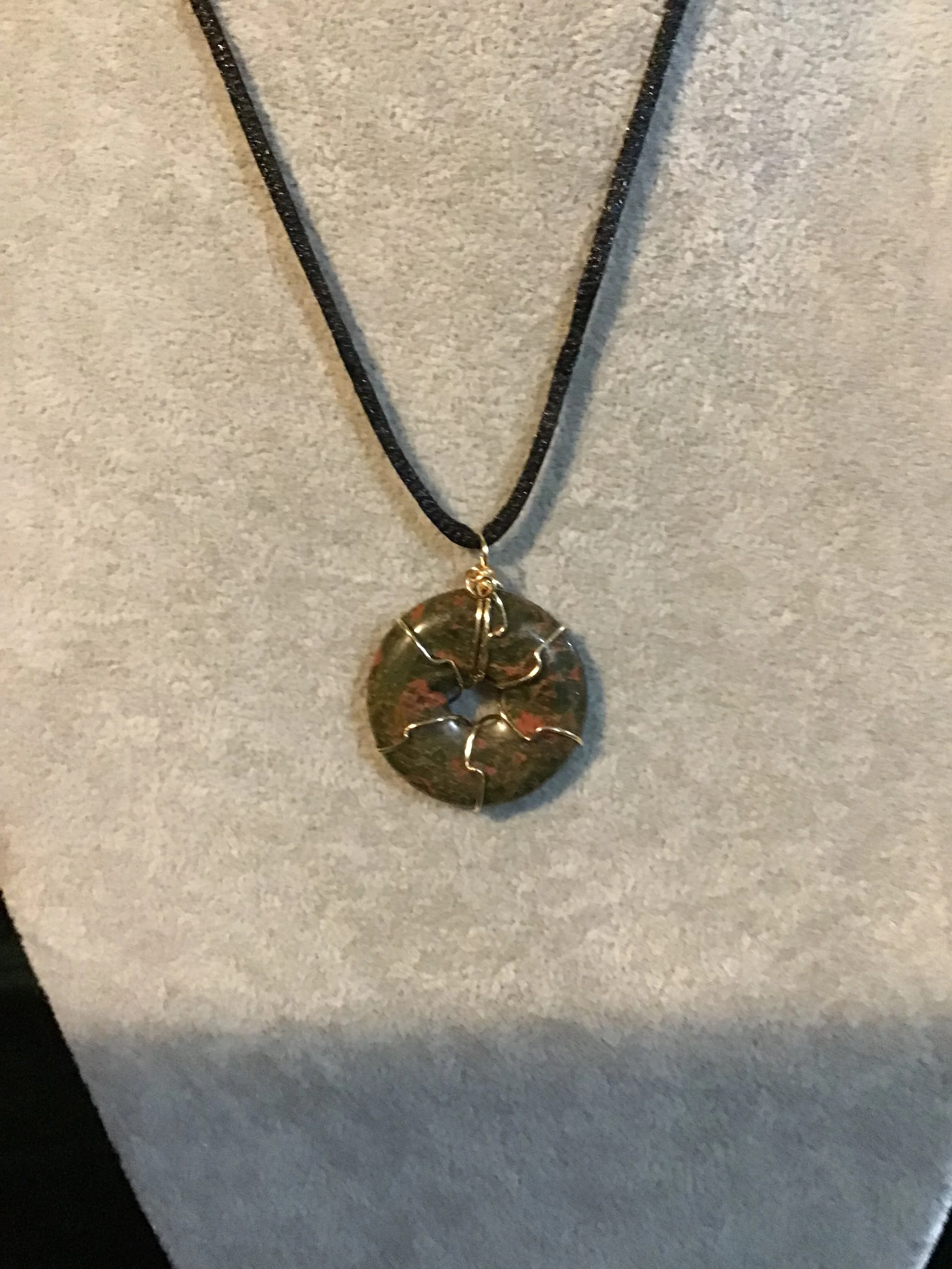 Wire wrapped Unakite gemstone donut on18 black satin adjustable cord