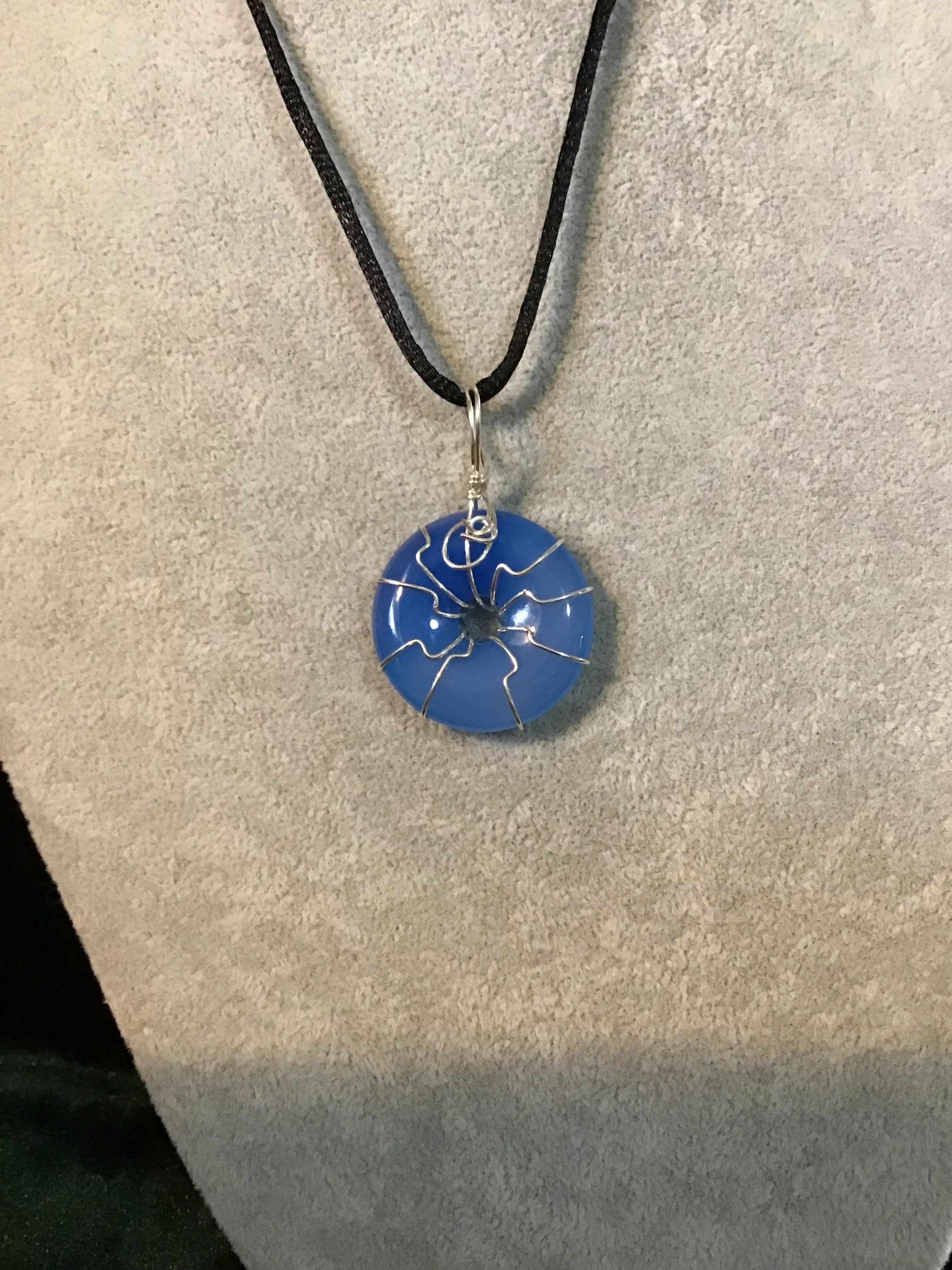 Wire wrapped Blue Agate gemstone donut on18 black satin adjustable cord