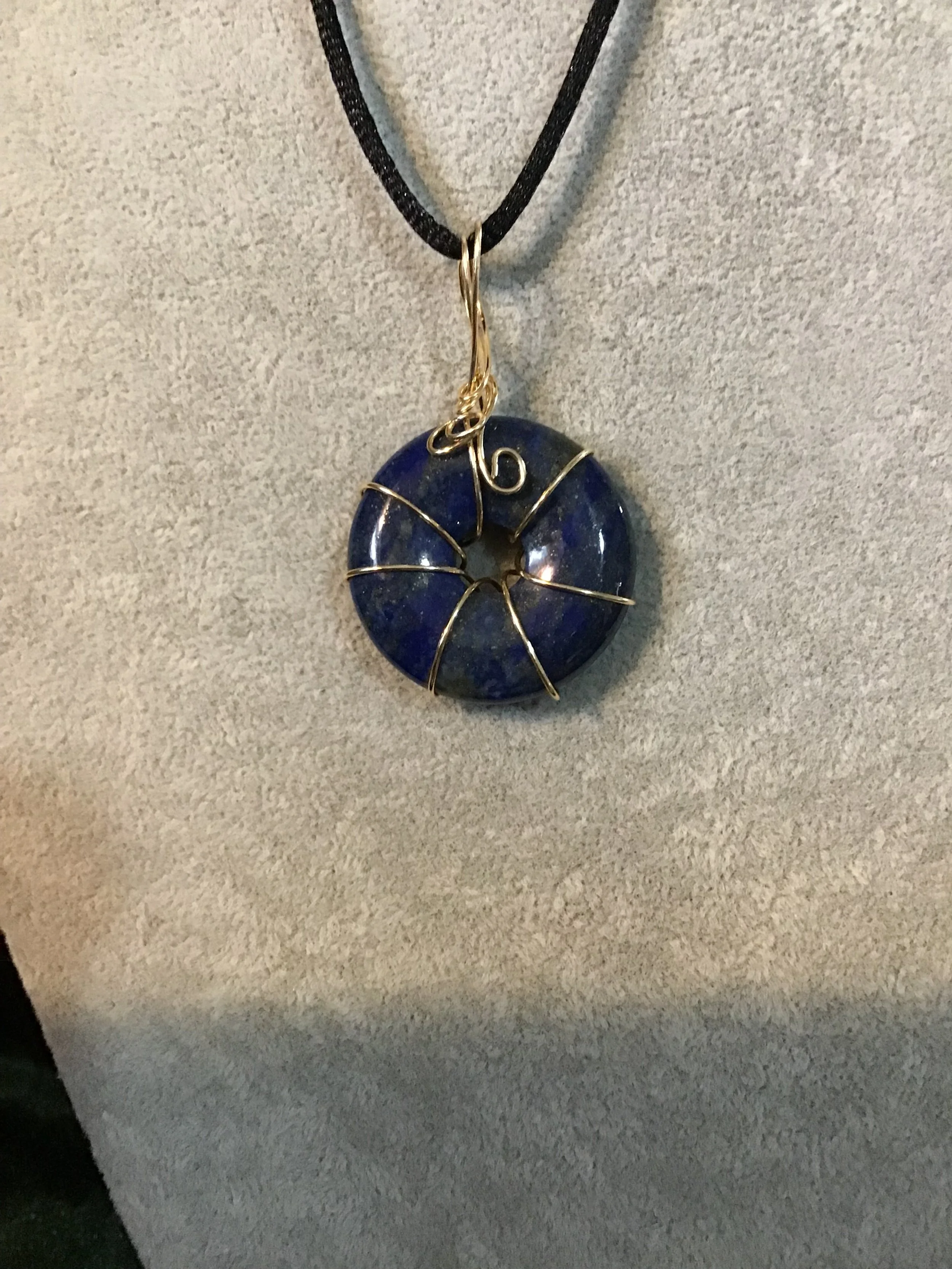 Wire wrapped Lapis Lazuli gemstone donut on18 black satin adjustable cord