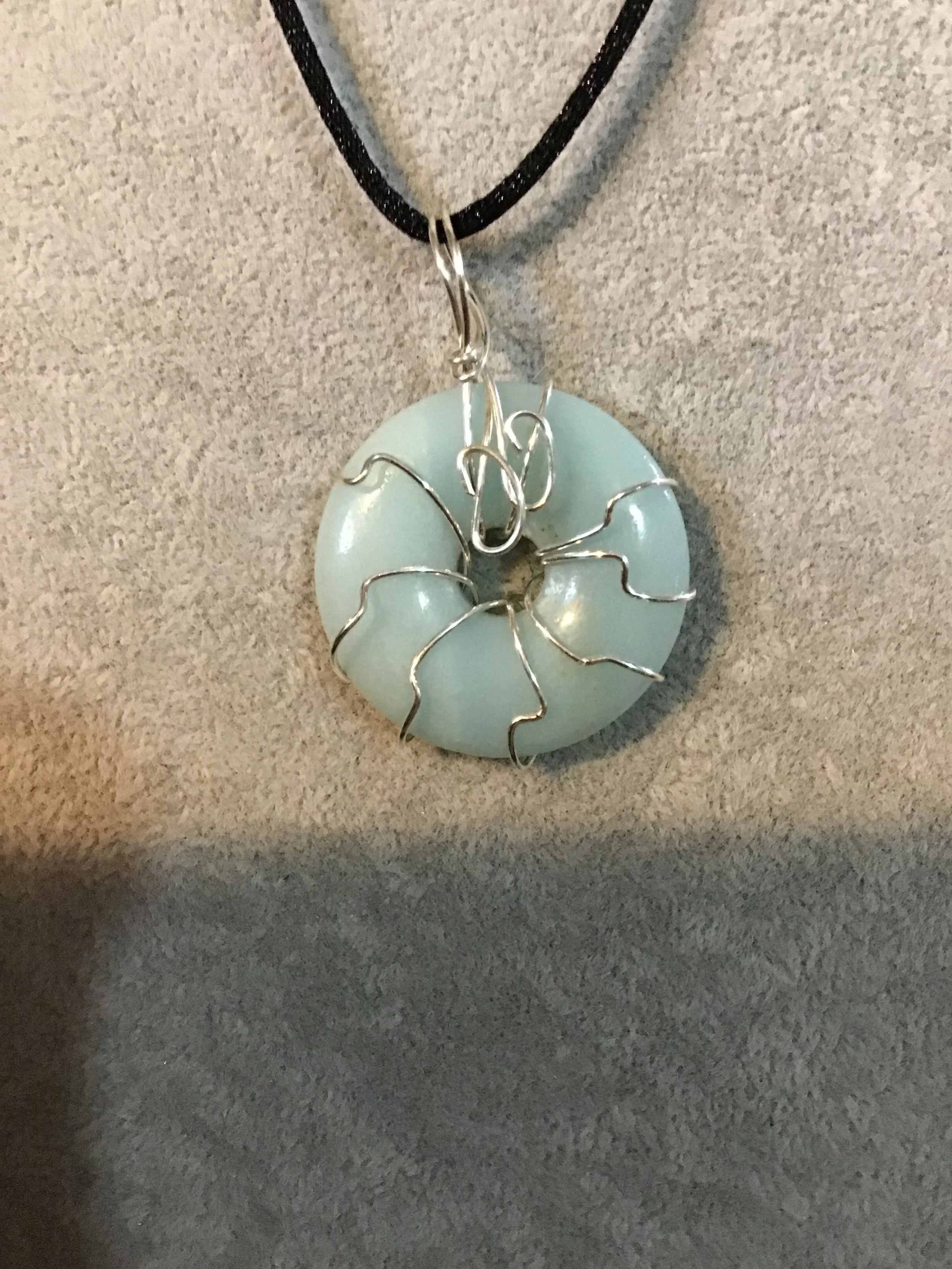 Wire wrapped Amazonite gemstone donut on18 black satin adjustable cord