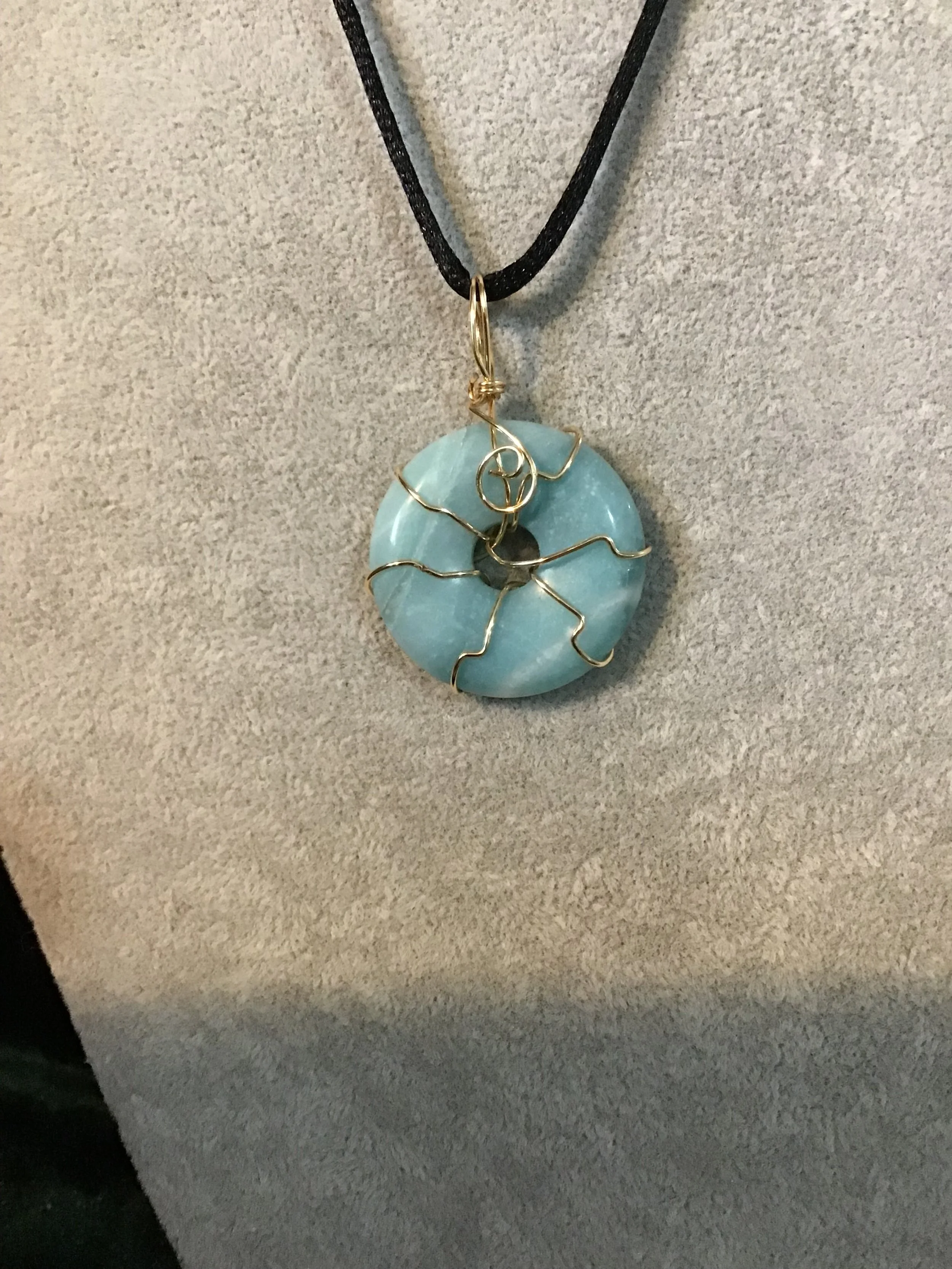 Wire wrapped Blue Amazonite gemstone donut on18 black satin adjustable cord