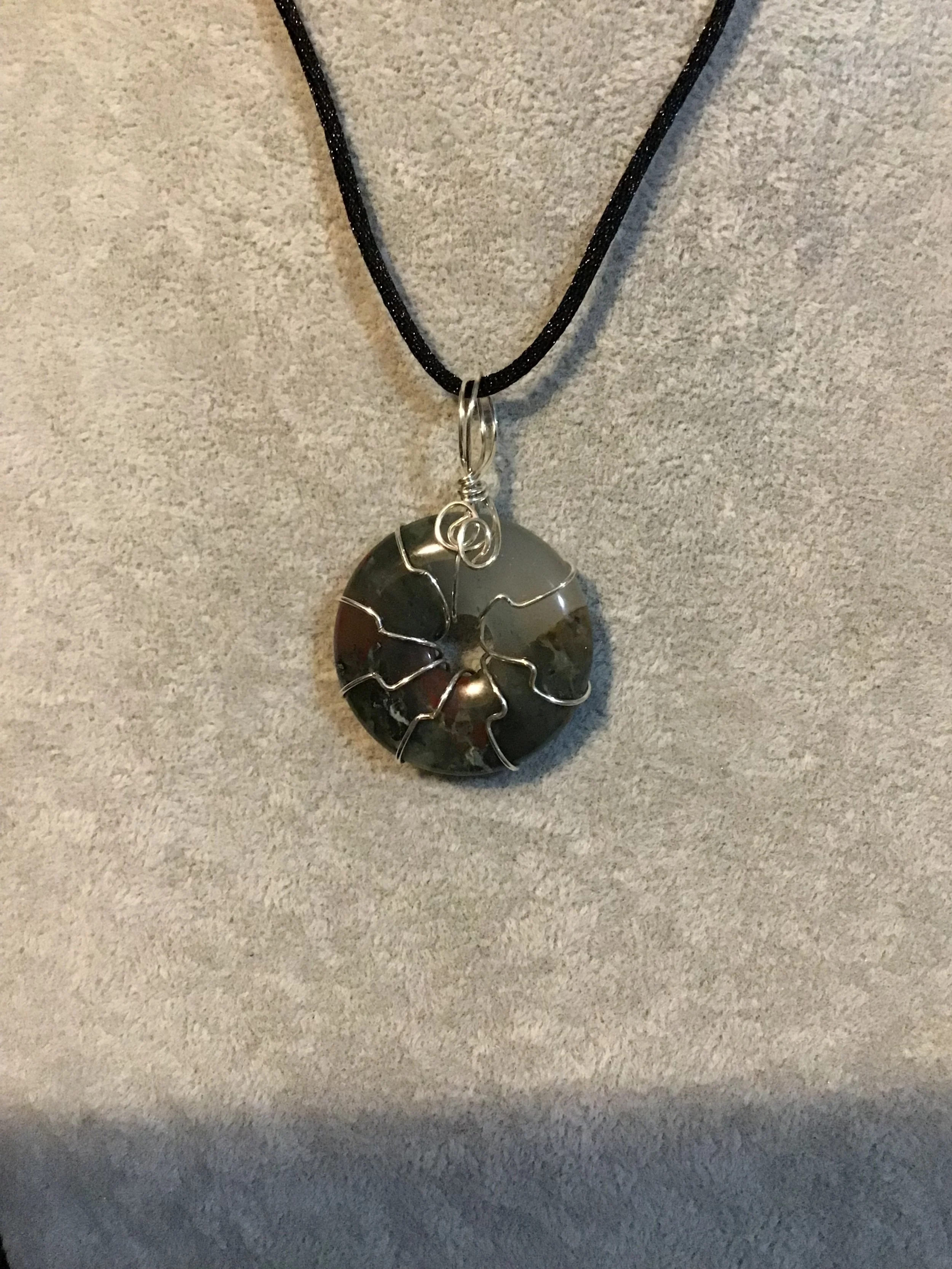 Wire wrapped African Bloodstone gemstone donut on18 black satin adjustable cord