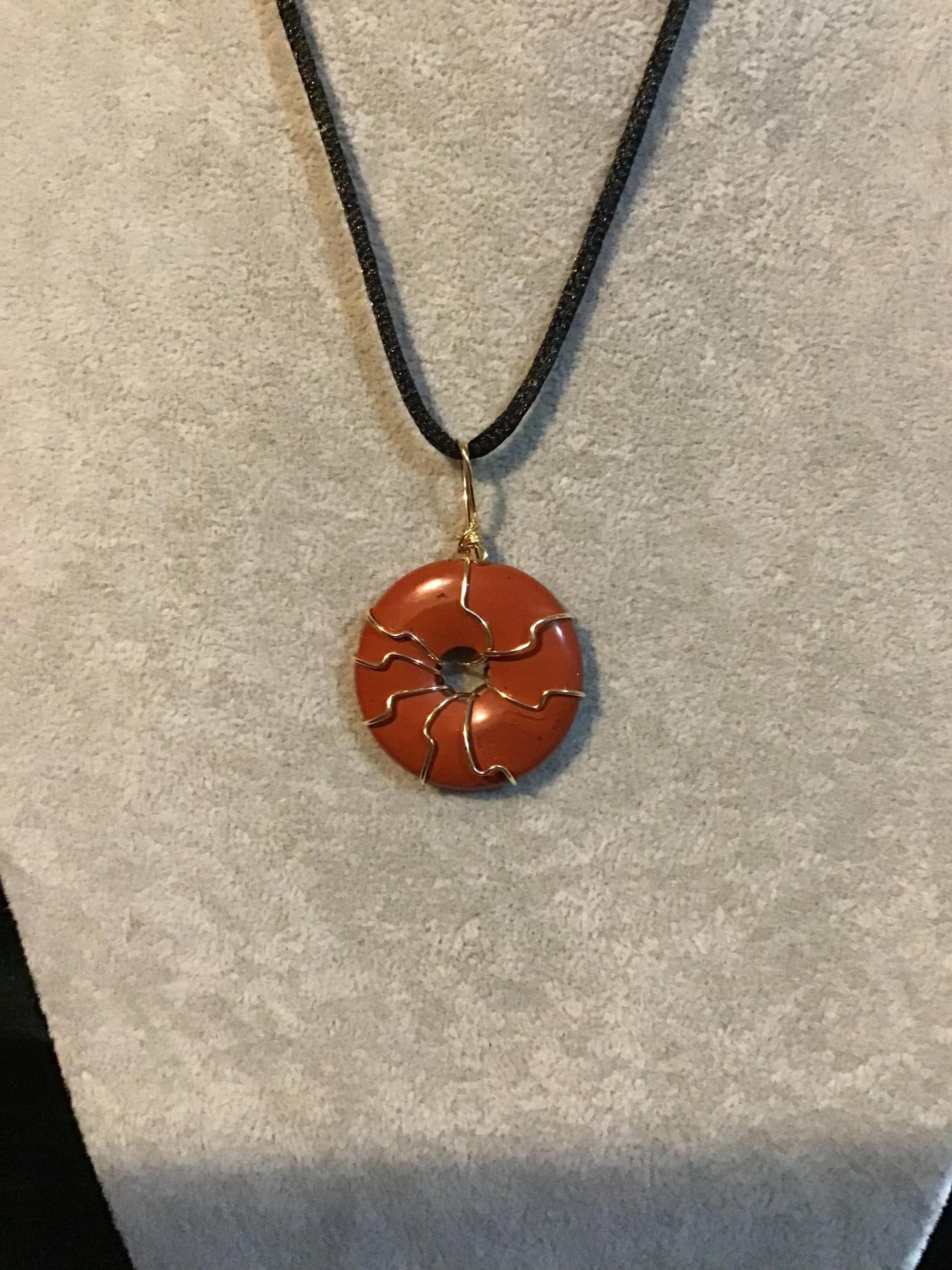 Wire wrapped Red Jasper gemstone donut on18 black satin adjustable cord