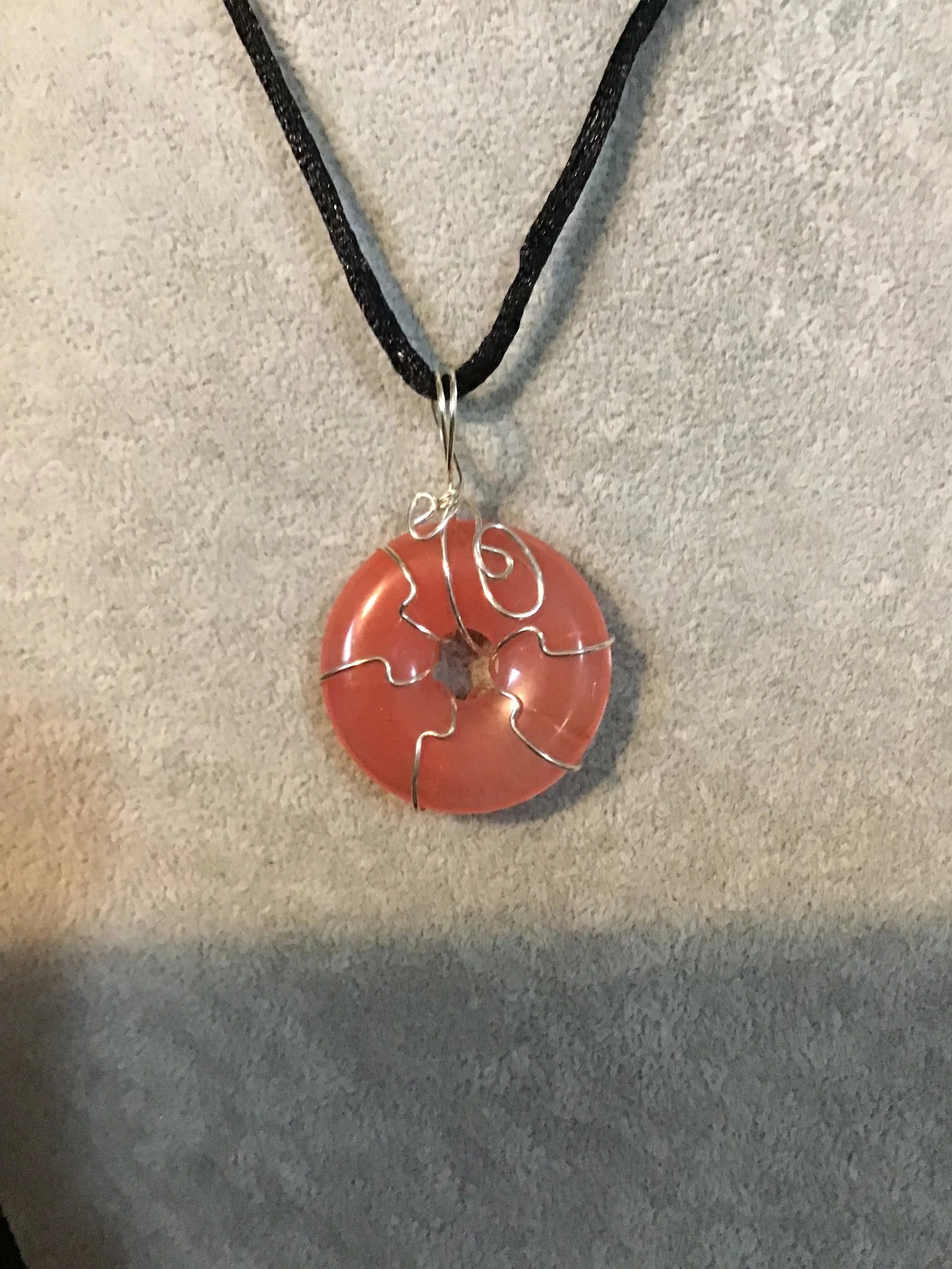 Wire wrapped Cherry Quartz gemstone donut on18 black satin adjustable cord