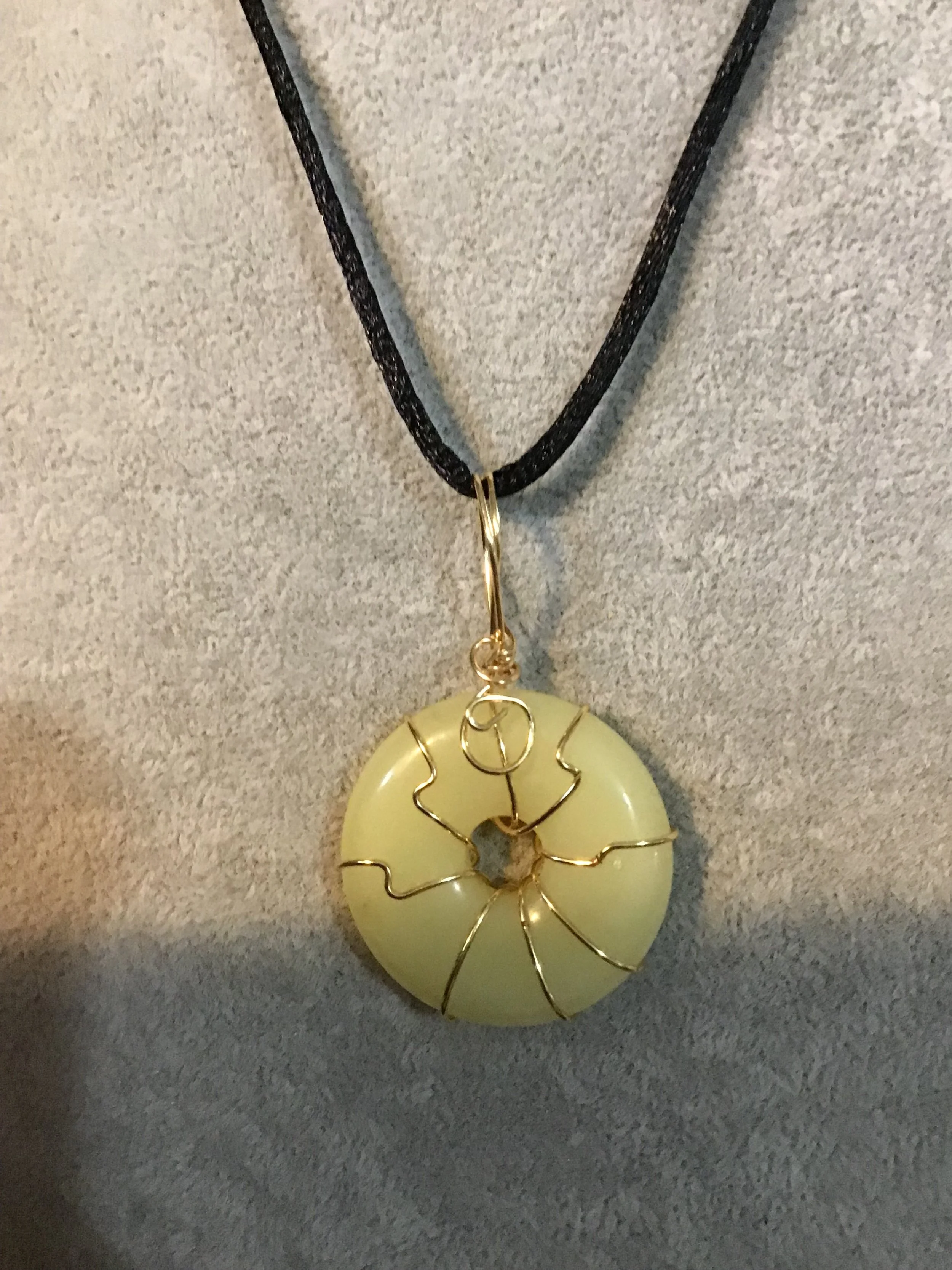 Wire wrapped Yellow Jade gemstone donut on18 black satin adjustable cord