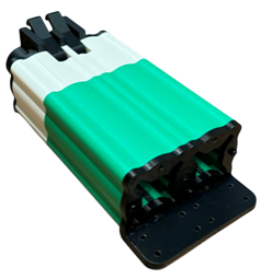 A cluster of green and white plastic batteries or battery-like objects.