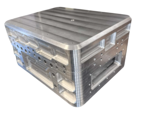 A metal mold with a ribbed surface, used for manufacturing or industrial purposes.
