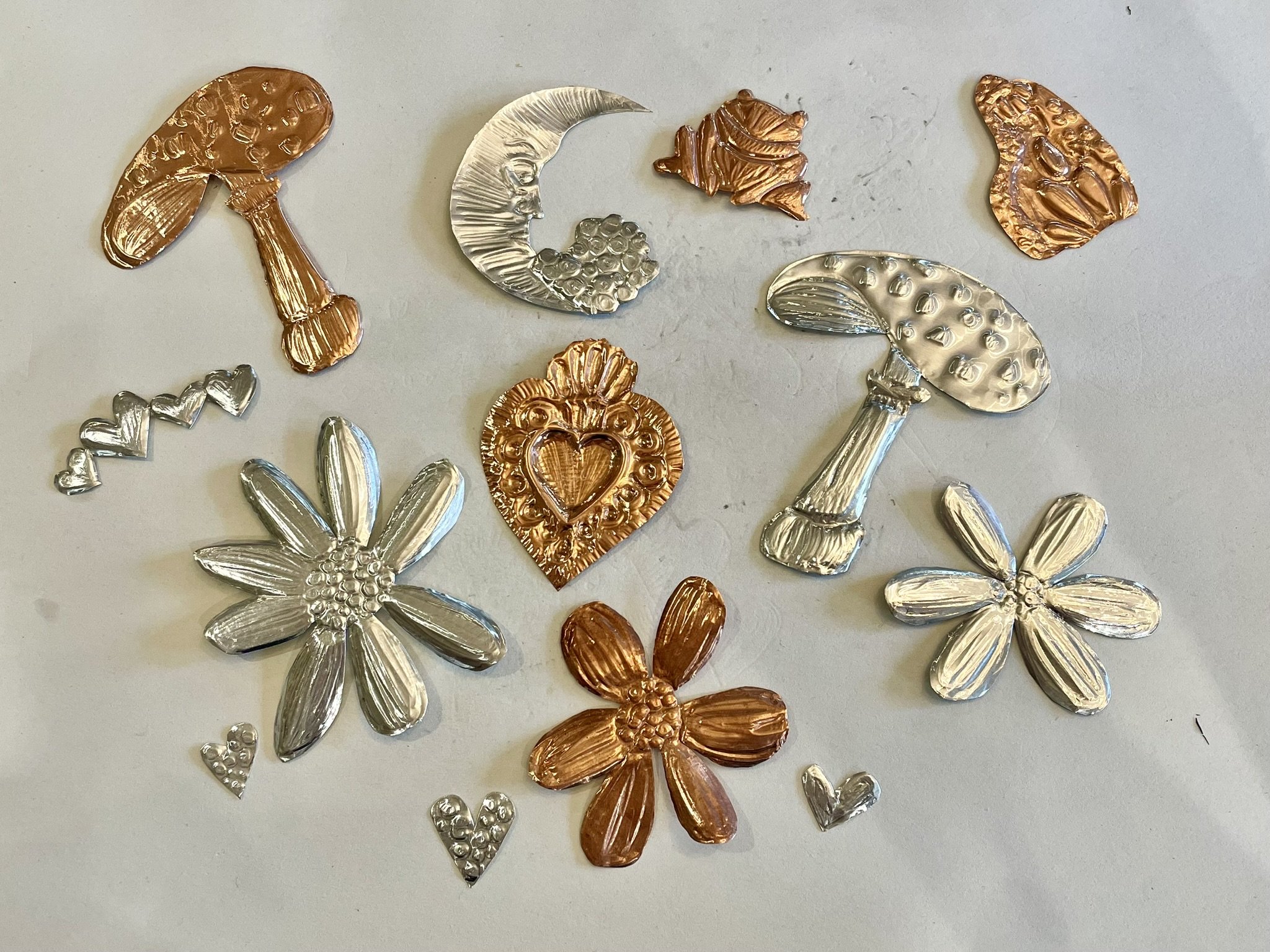 12/19  Embossed Metal Ornaments
