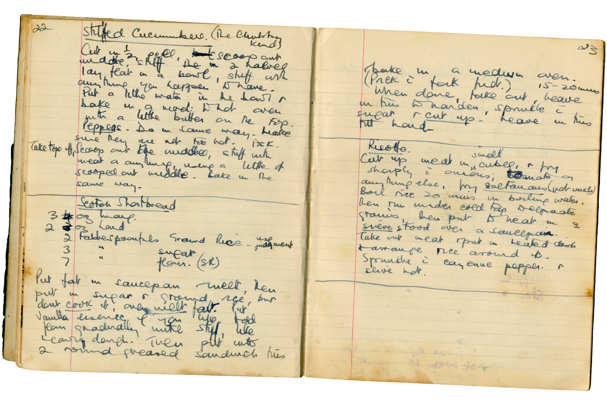 An open vintage notebook featuring handwritten recipes on aged, stained, lined pages.