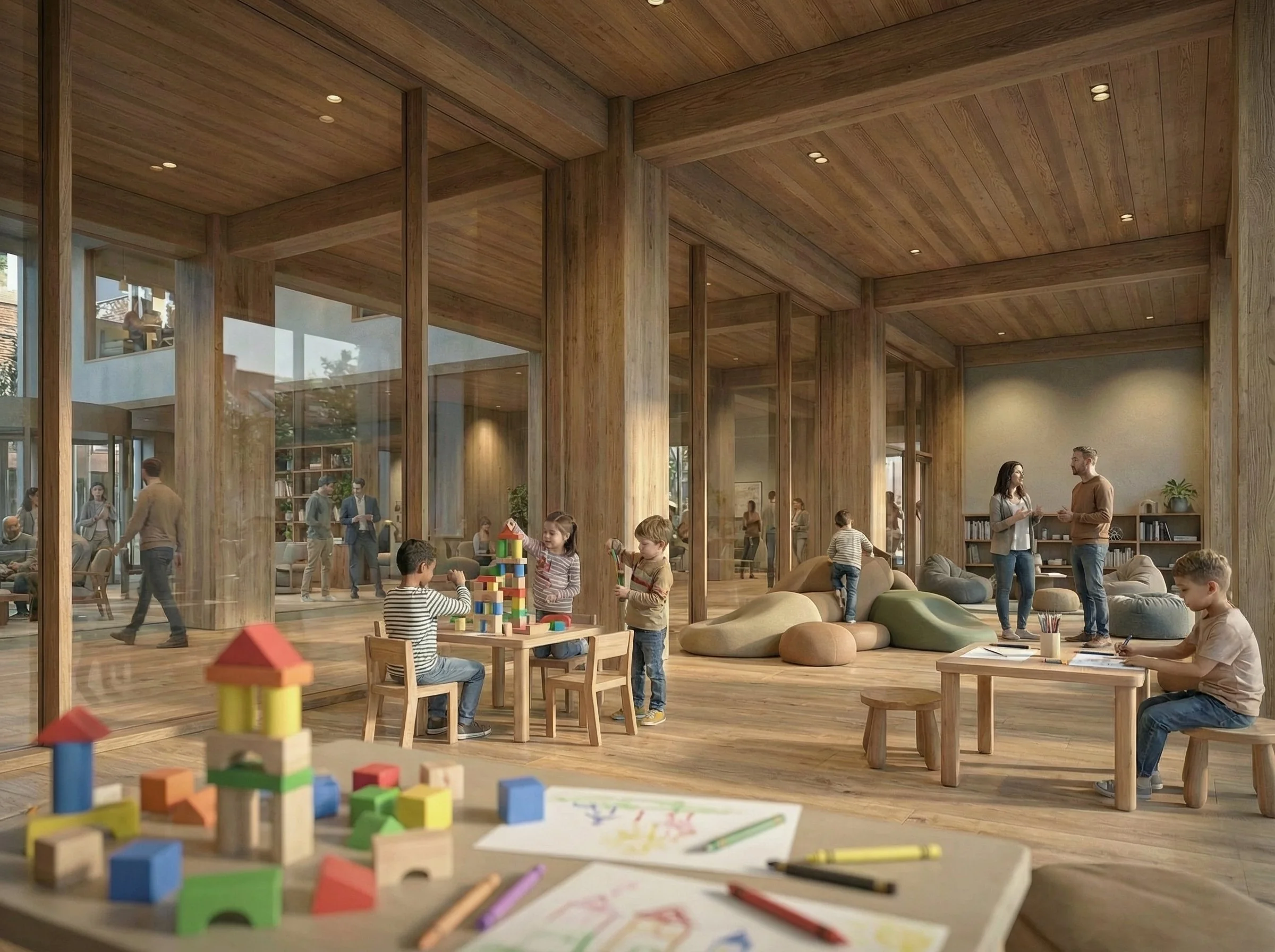 Children playing with building blocks in a large, modern indoor space with wooden walls and furniture, adults talking in the background, and art supplies on a table.