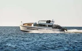 Motor yacht speeding on open water