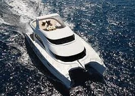 A white luxury yacht sailing on the ocean.