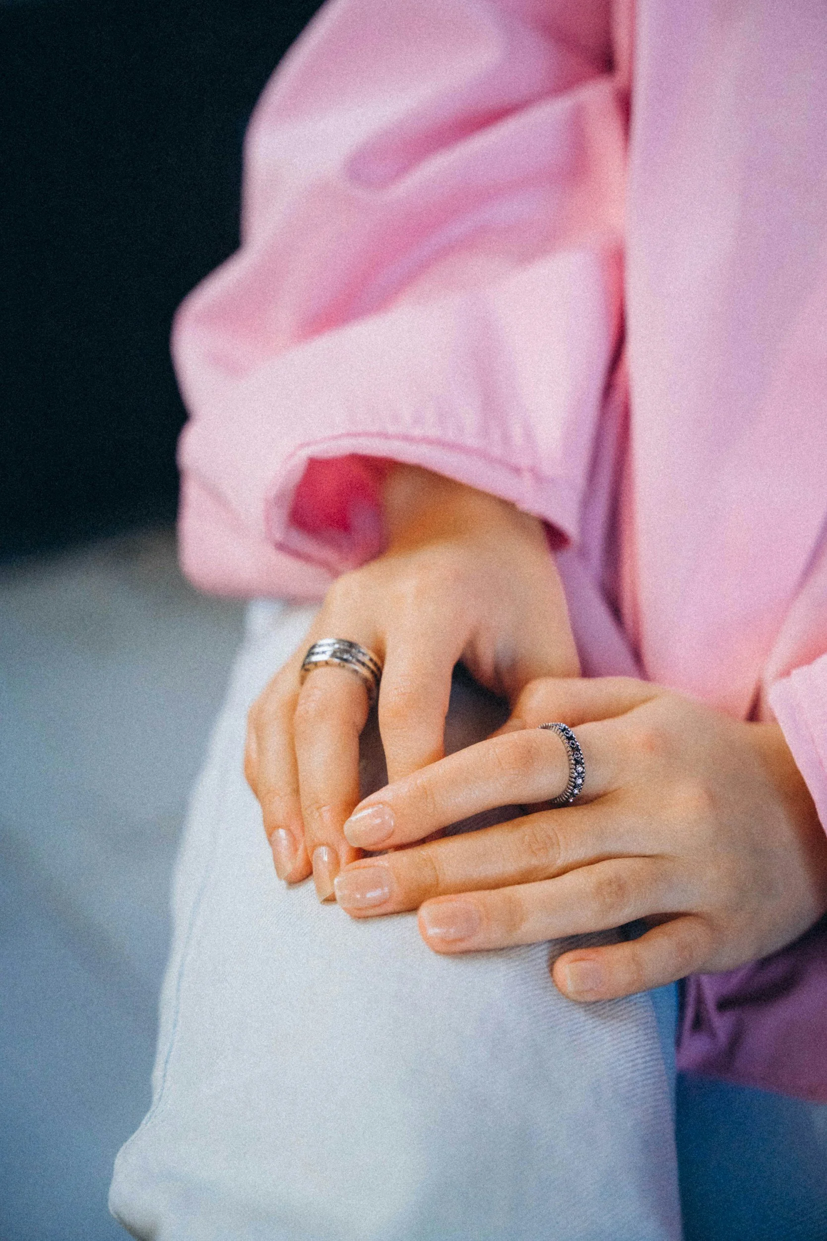 pink shirt women hands rings