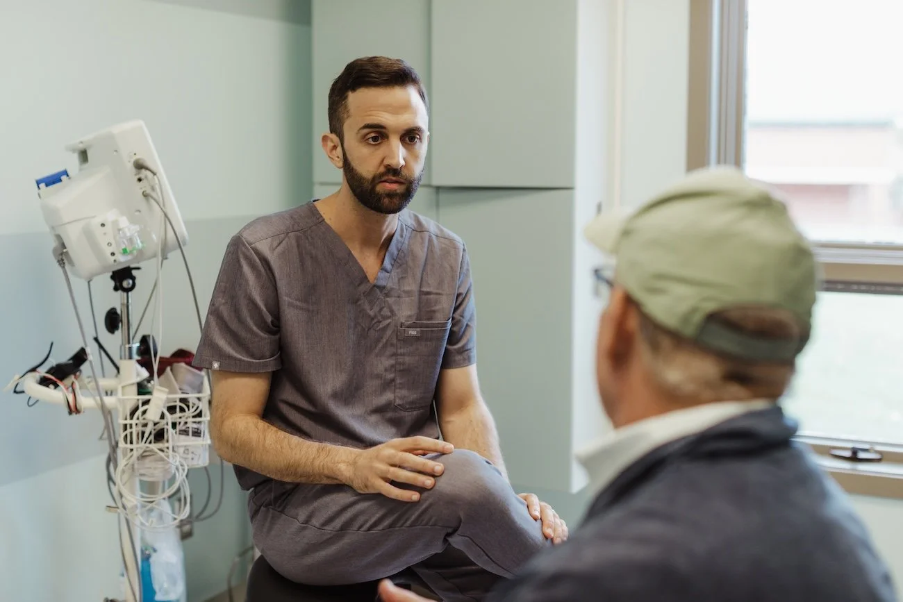 Dr. Bulcher speaks to an oral surgery patient